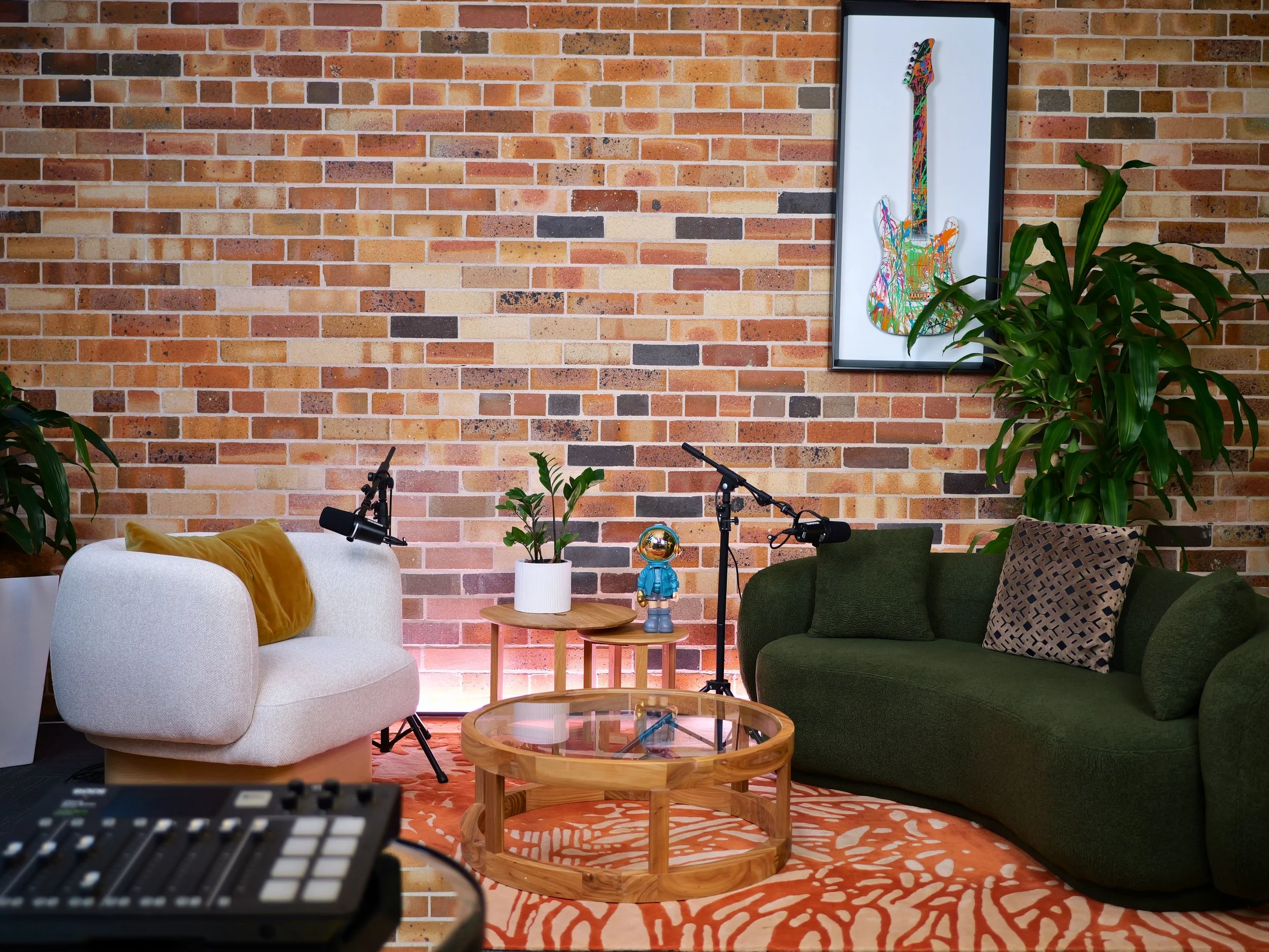 The Talk Show set — brick wall and casual seating